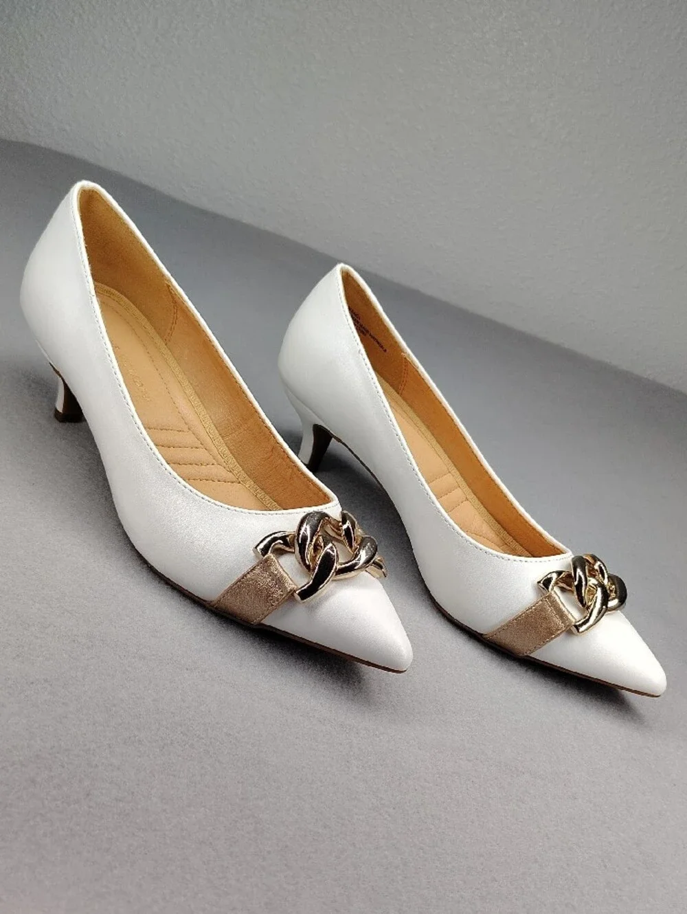 Adrienne Vittadini White Kitten Heels Rose Gold Accents Holding Gold Chain